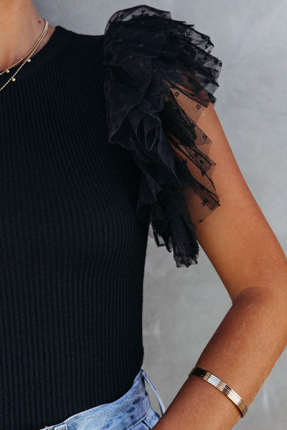 Haut en maille côtelée à volants et manches en maille à pois