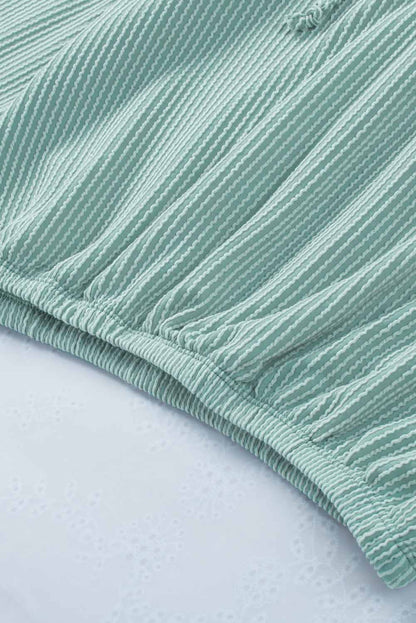 Sudadera con capucha holgada y cuello en V de canalé