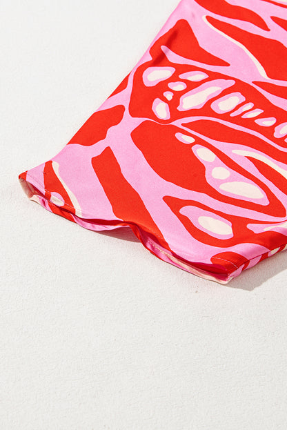 Chemisier surdimensionné rouge à imprimé abstrait, col en V et manches chauve-souris