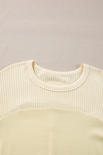Haut beige à manches longues en tricot thermique avec coutures apparentes