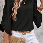 Chemisier noir à volants et manches 3/4 à col rond