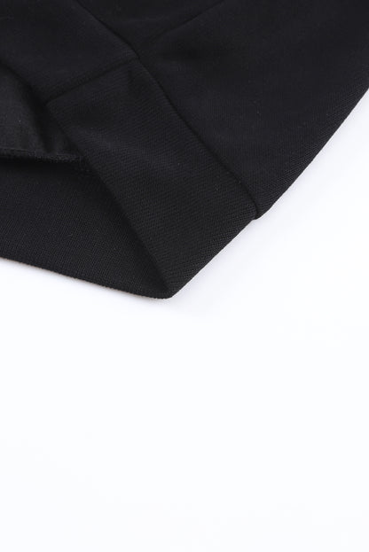 Pull violet en tricot à col en V et poignets boutonnés