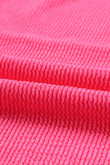 Top de manga larga acanalado con bloques de color patchwork