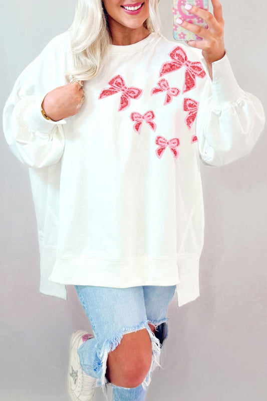Sweat-shirt oversize blanc à paillettes et nœud papillon