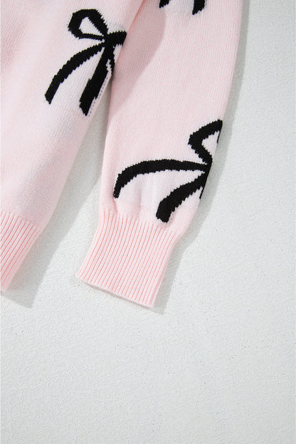 Pull ample en maille rose clair à motif nœud