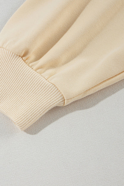 Sweat-shirt beige à manches boutonnées et épaules tombantes