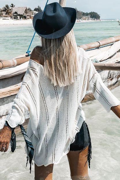 Pull ample à col en V et détails creux blancs 