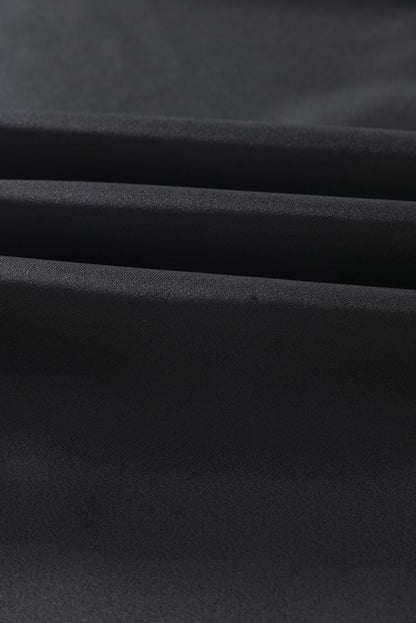 Blusa elegante de manga larga con cuello vuelto negro