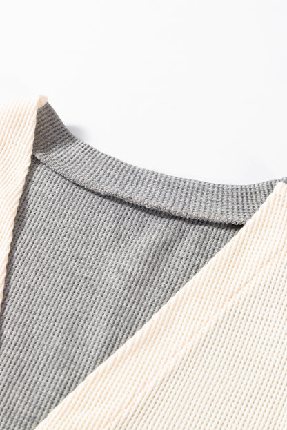 Cardigan ouvert à rayures noires et patchwork avec poche