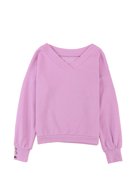 Pull violet en tricot à col en V et poignets boutonnés