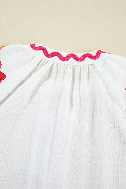 Chemisier texturé à manches bouffantes et broderie florale blanche