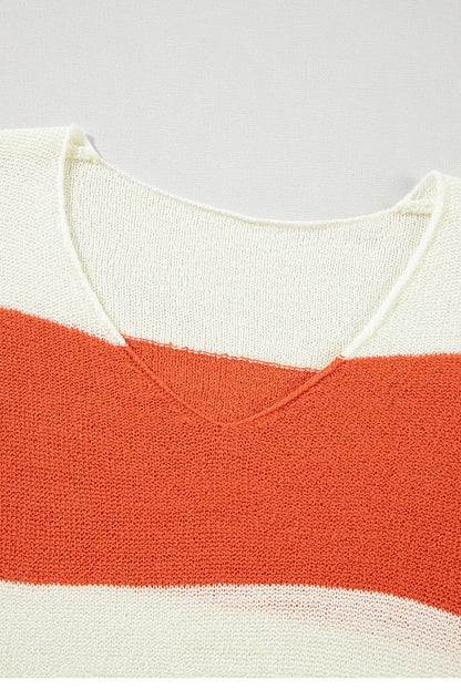 Pull ample à rayures orange et blocs de couleurs, épaules tombantes et manches bouffantes