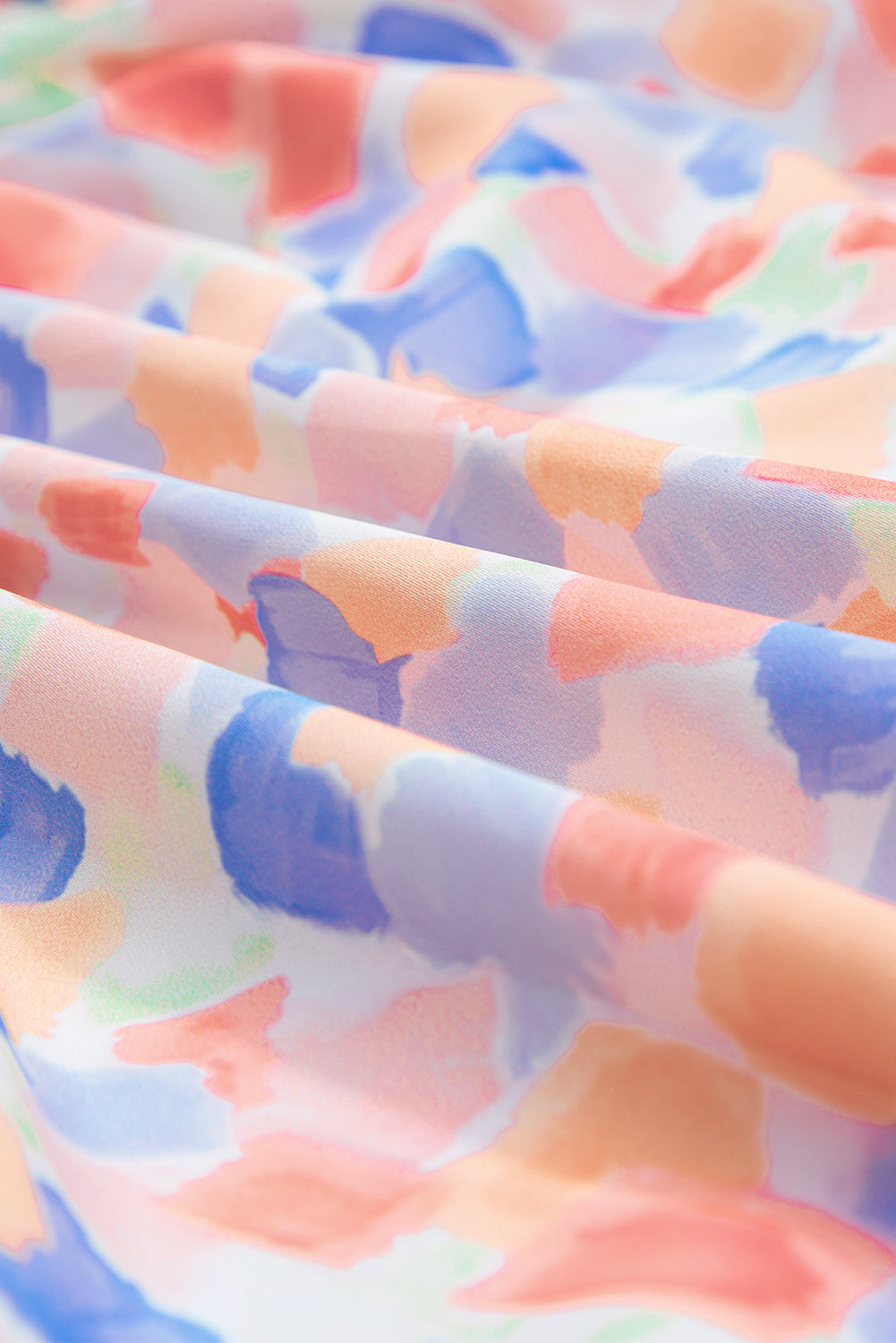 Chemisier rose à imprimé abstrait et à volants