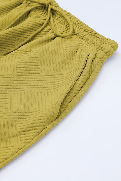 Conjunto de camiseta holgada con textura gris y pantalón con cordón