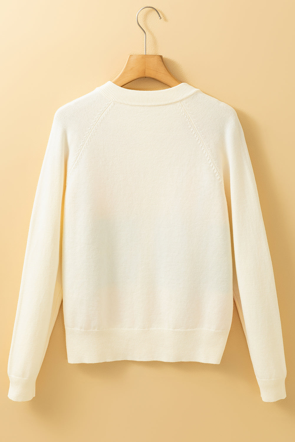 Cardigan boutonné à rayures blanches et motifs colorés sur le devant