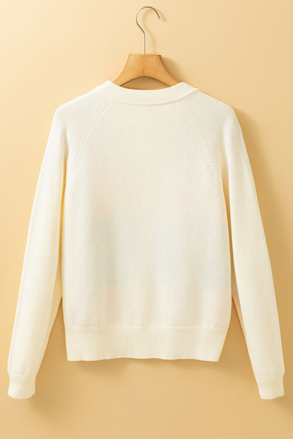 Cardigan boutonné à rayures blanches et motifs colorés sur le devant