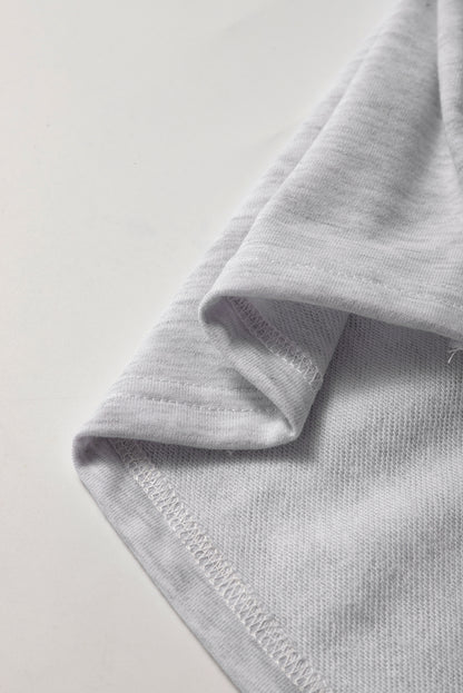 Mini-jupe en molleton gris clair avec cordon de serrage et poches