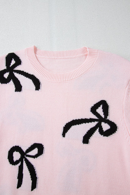 Pull ample en maille rose clair à motif nœud