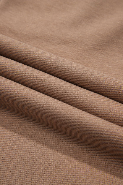 Robe courte à manches longues et col rond en chèvre avec ourlet à volants superposés