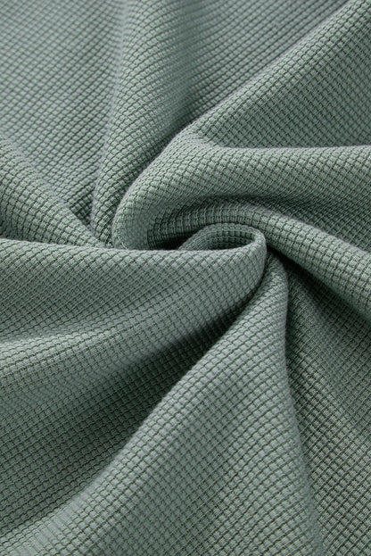 Haut à col en V et épaules tombantes en tricot gaufré Clearly Aqua