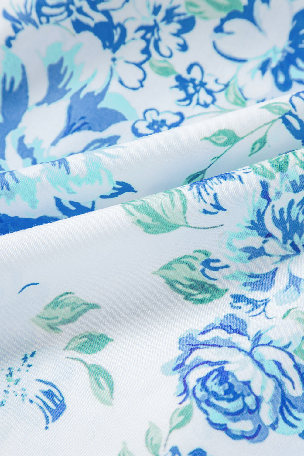 Chemise boutonnée à volants et imprimé floral bleu ciel