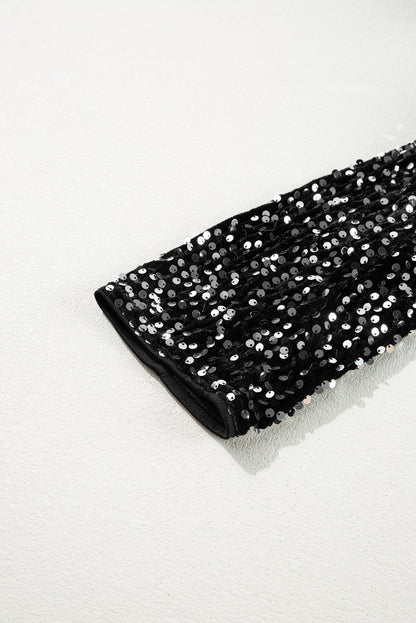 Veste courte ouverte à paillettes noires