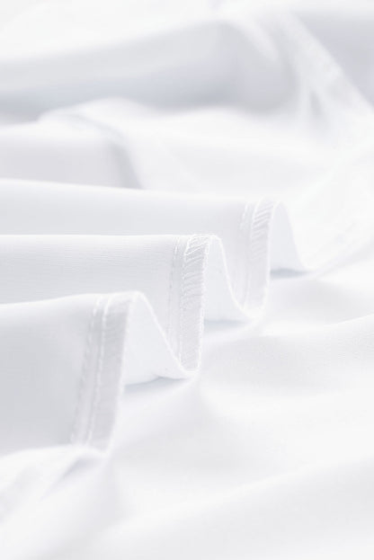 Blusa con cuello en V y media manga de color liso