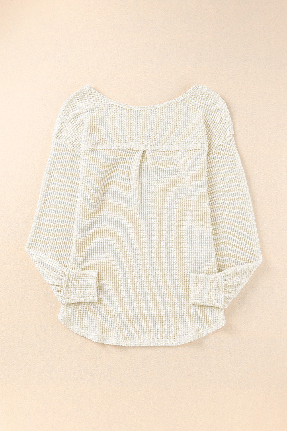 Haut ample en tricot gaufré à col fendu et poches