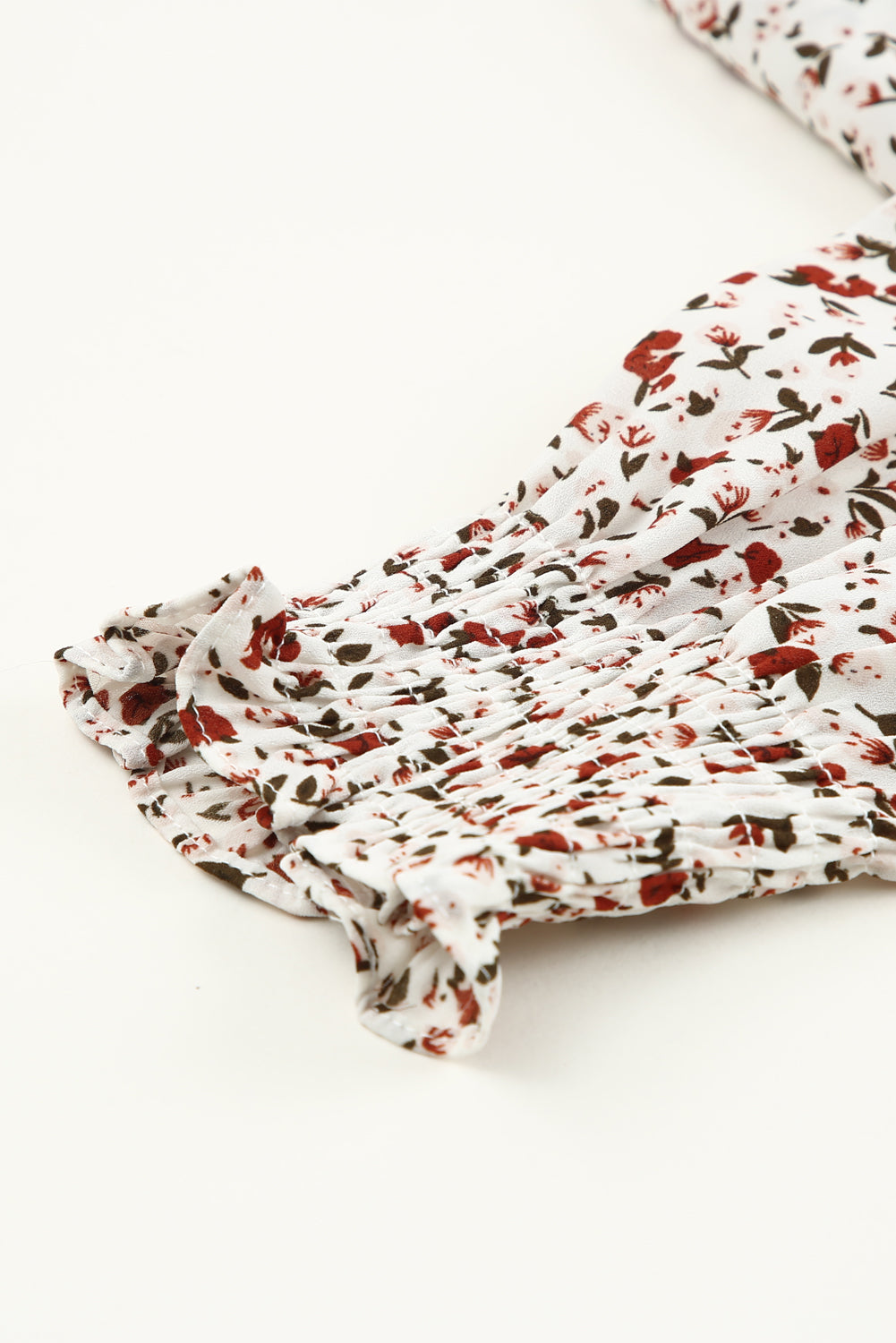 Blusa de manga larga con volantes y lazo delantero con estampado floral