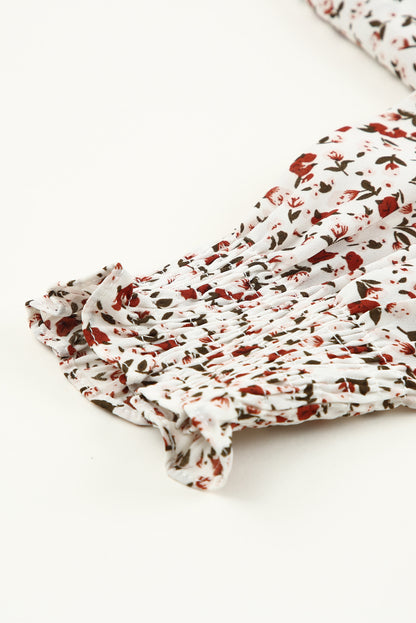 Blusa de manga larga con volantes y lazo delantero con estampado floral