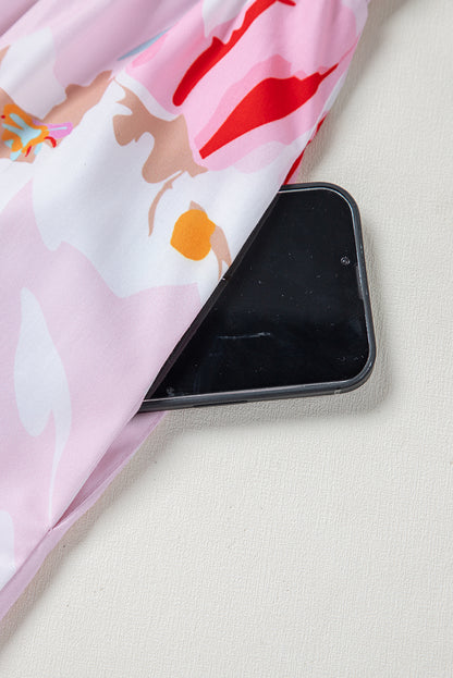 Robe longue smockée à imprimé floral rose et épaules nouées