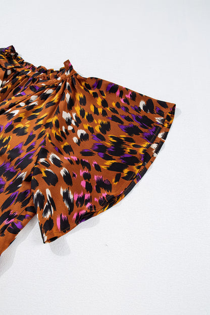 Chemisier orange à imprimé léopard, drapé, manches courtes, col en V fendu