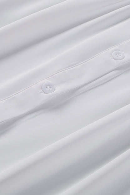 Chemisier boutonné à manches bouffantes de couleur unie