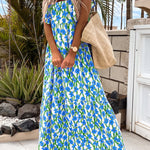 Robe longue bleue à imprimé floral, col carré et bretelles à volants