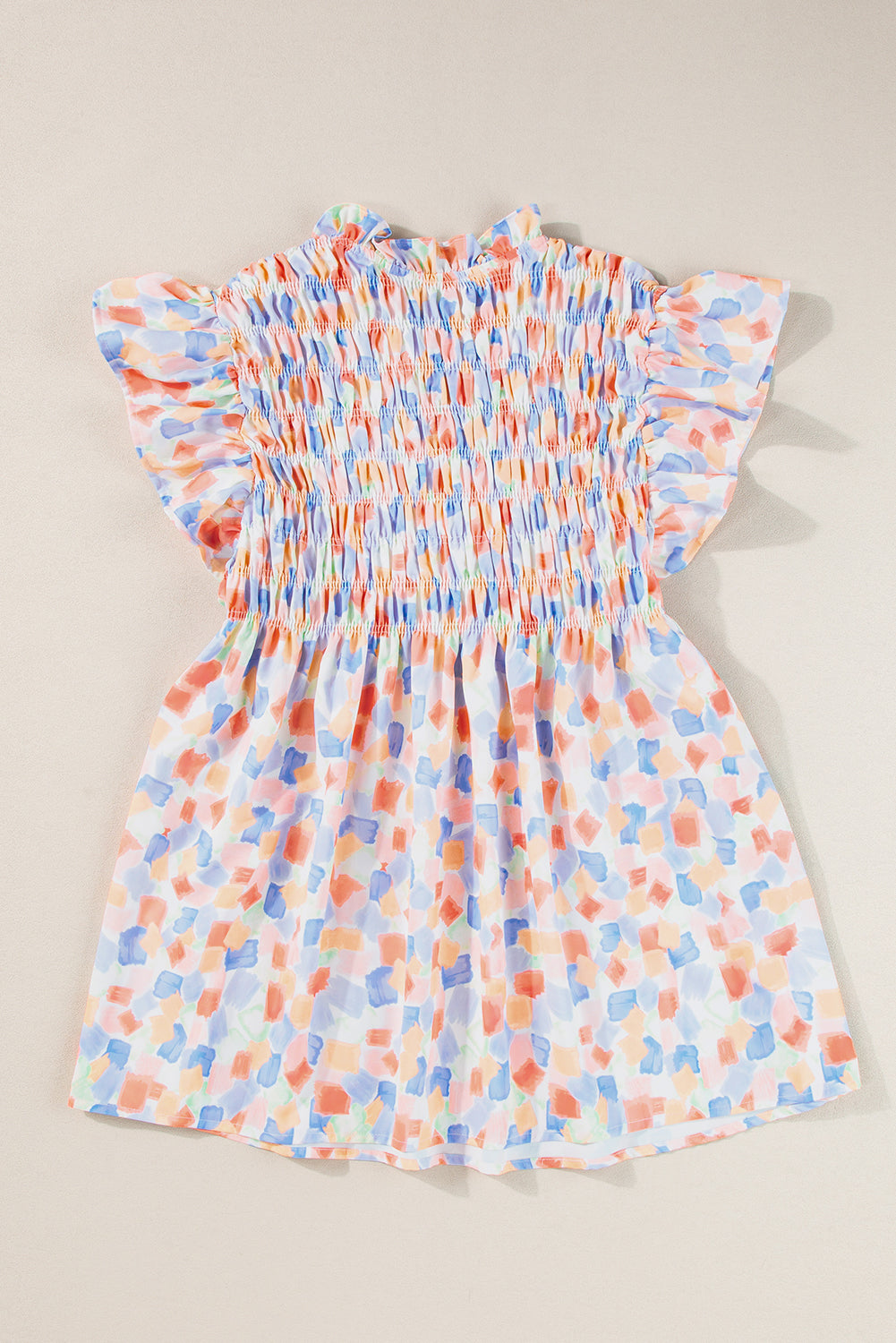 Chemisier rose à imprimé abstrait et à volants