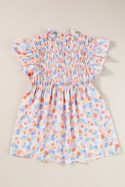 Chemisier rose à imprimé abstrait et à volants