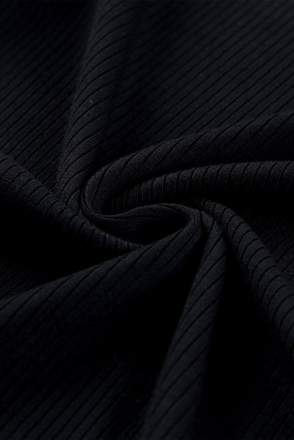 Haut en maille côtelée à volants et manches en maille à pois