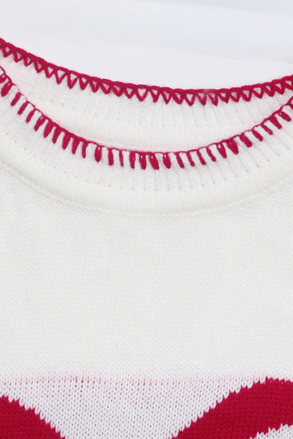 Pull graphique ample de Noël à motif de nœud blanc et bordure contrastée