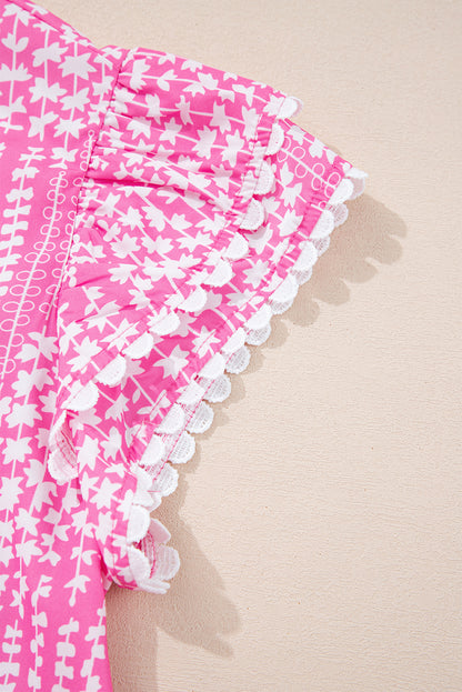 Chemisier rose à imprimé abstrait et bordure Ric Rac, manches flottantes, col en V cranté