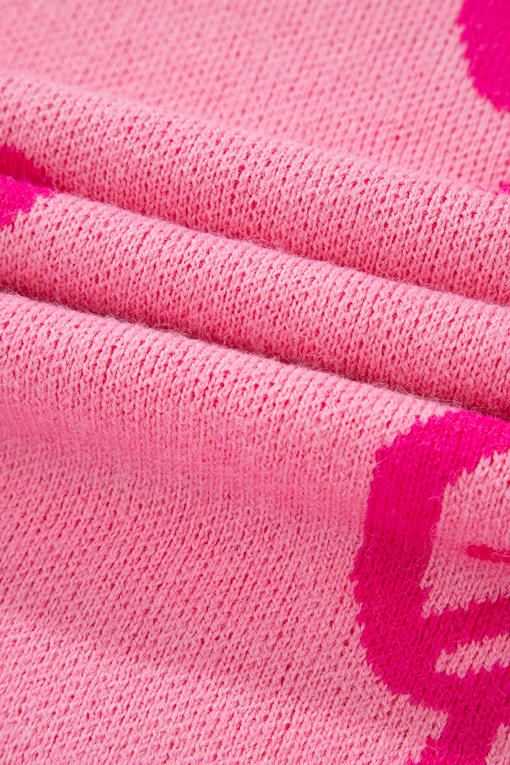 Pull ample à épaules tombantes et motif nœud rose