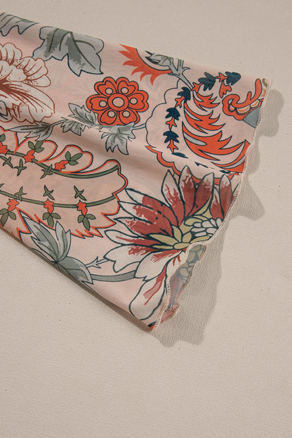 Chemisier orange à imprimé floral, col en V profond, manches cloche et nœud