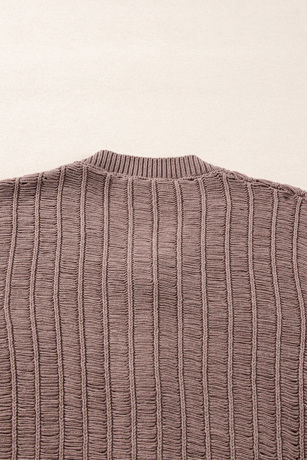 Cardigan boutonné en tricot texturé découpé en chèvre