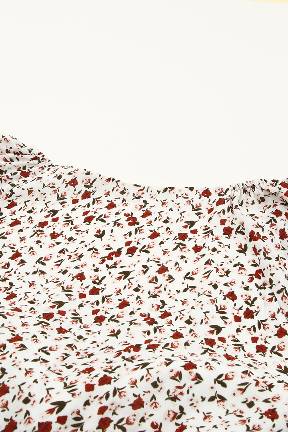 Blusa de manga larga con volantes y lazo delantero con estampado floral