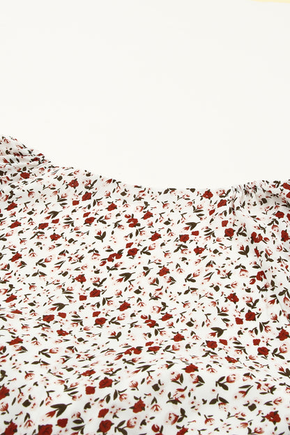 Blusa de manga larga con volantes y lazo delantero con estampado floral