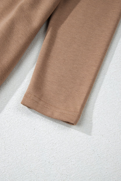 Robe courte à manches longues et col rond en chèvre avec ourlet à volants superposés