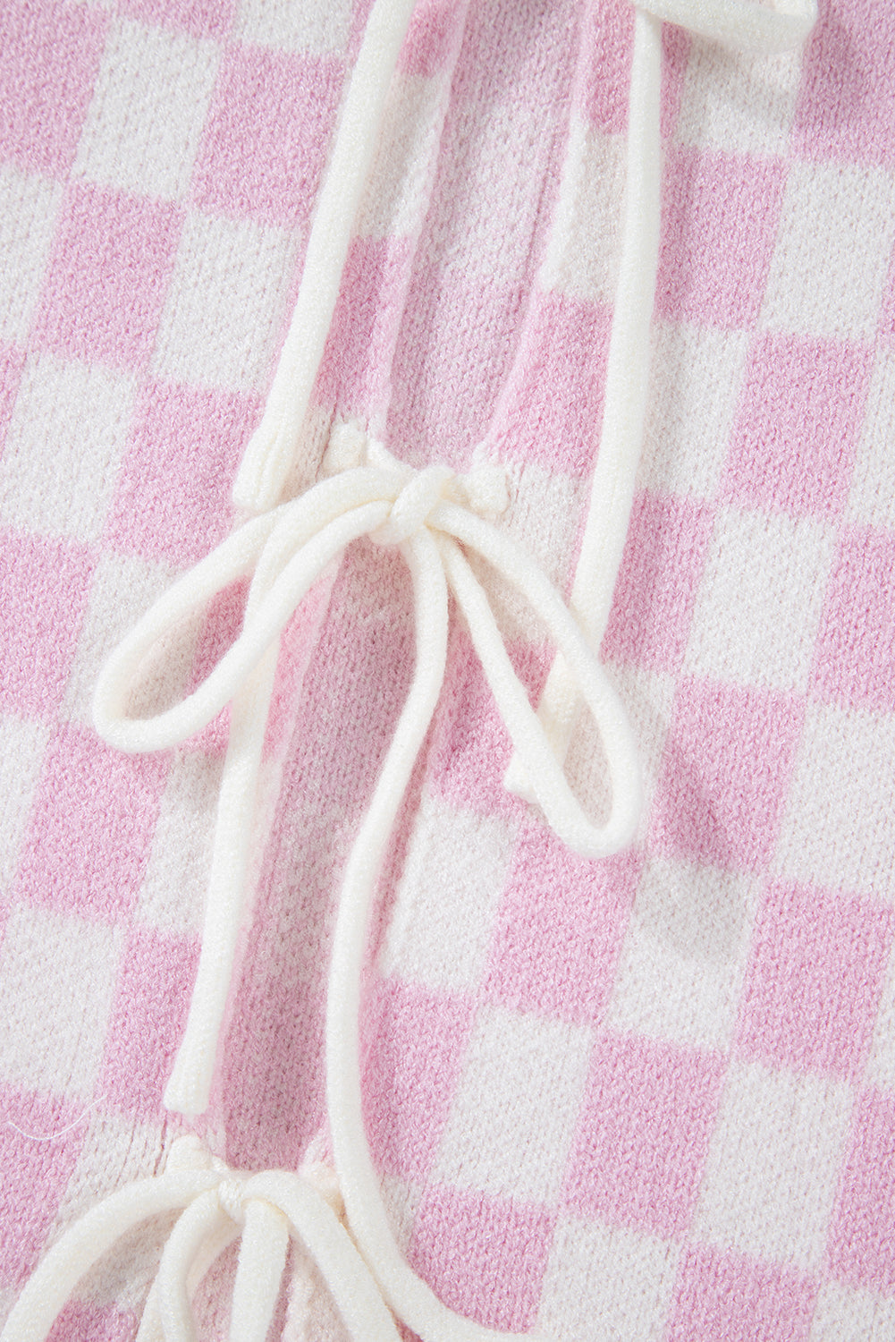 Cardigan rose clair à carreaux, manches 3/4, volants et lacets