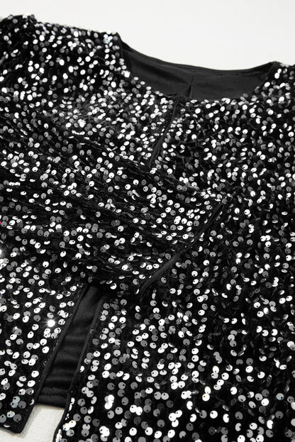 Veste courte ouverte à paillettes noires