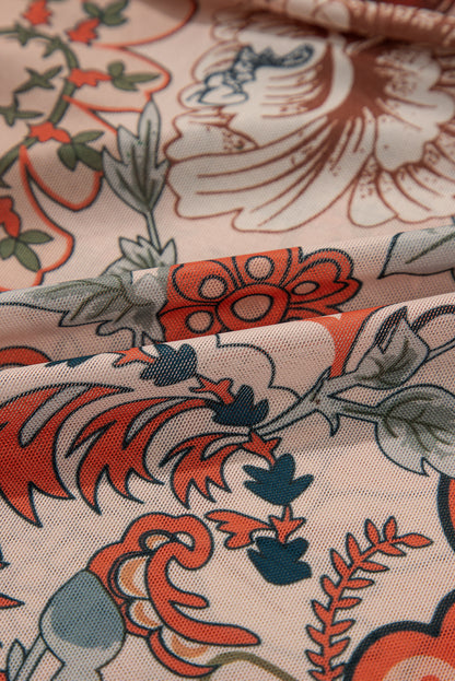 Chemisier orange à imprimé floral, col en V profond, manches cloche et nœud