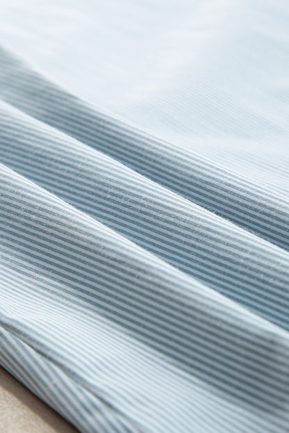 Chemise boutonnée à manches longues et à volants bleu ciel