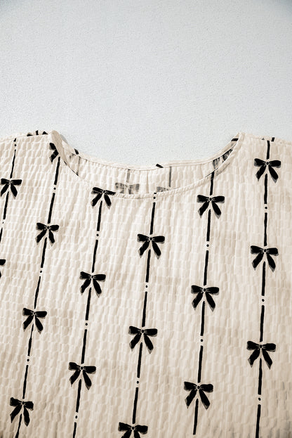 Haut à manches courtes bouffantes et imprimé nœud beige